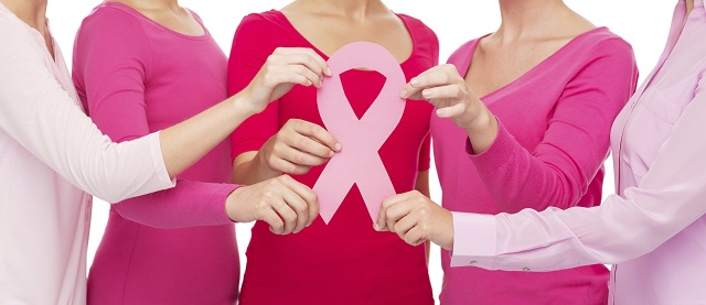 healthcare, people and medicine concept - close up of women in blank shirts with pink breast cancer awareness ribbon over white background